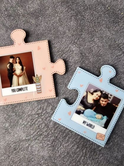 Another example of the couple's puzzle magnets, this time customized with maternity and newborn photos to celebrate a growing family.