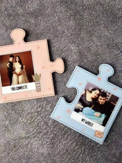 Another example of the couple's puzzle magnets, this time customized with maternity and newborn photos to celebrate a growing family.