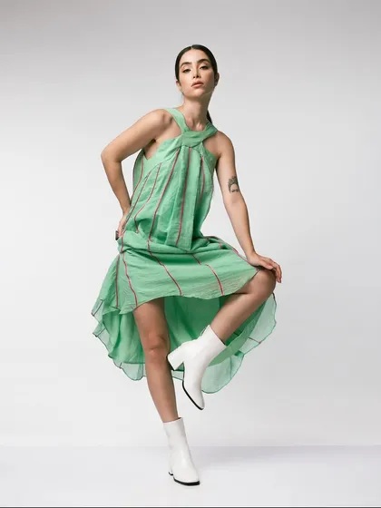 For this shoe lookbook, I paired white block-heel boots with a flowing mint green dress. The dynamic pose and contrasting styles create a fresh, playful image that is perfect for a spring or summer campaign.