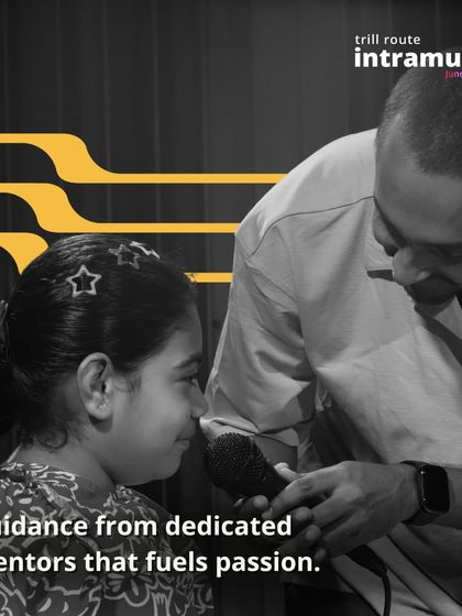 The journey is better with a guide. Here, one of our mentors offers some last-minute encouragement to a young performer, showcasing the supportive guidance that fuels passion at our school.