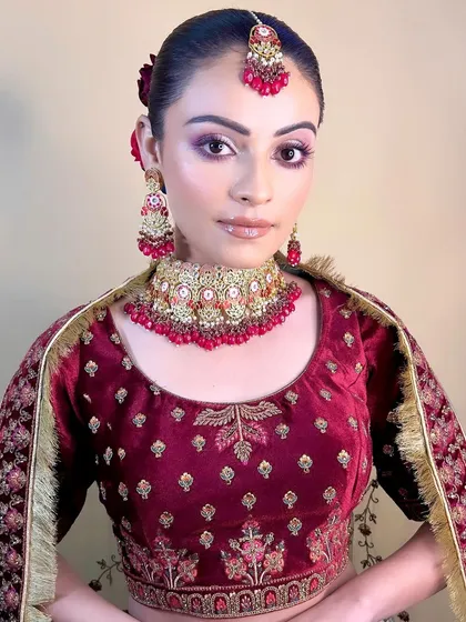 This image captures the full essence of a traditional bride, complete with flowers in her hair. My combined makeup and hair courses prepare you for complete bridal styling.