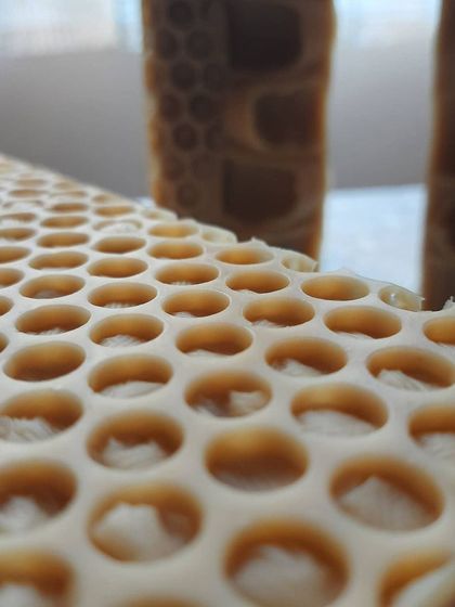 A macro shot of the honeycomb texture on my Goatmilk, Oats, and Honey soap. This design is created with bubble wrap, and it gives the bar a lovely, tactile feel.
