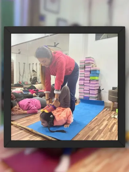 I love seeing my students grow stronger and more flexible. This picture captures a moment of assisted stretching to help deepen a backbend safely.