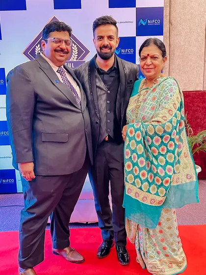 With my parents at the NIFCO 10th-anniversary event. Their support has been instrumental in my journey.
