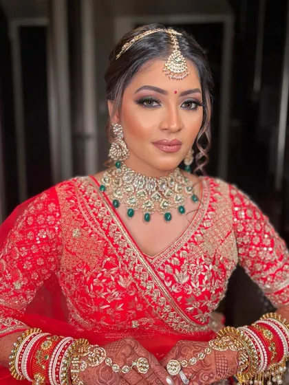 Krisha looking absolutely radiant in a classic red lehenga. I created a soft glam look with a focus on glowing skin and defined eyes to make her feel like a queen.