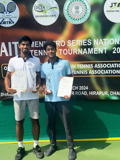 Ricky Chaudhary and his opponent with their trophies after a hard-fought final at the AITA Pro Series National Tournament in Dhanbad.