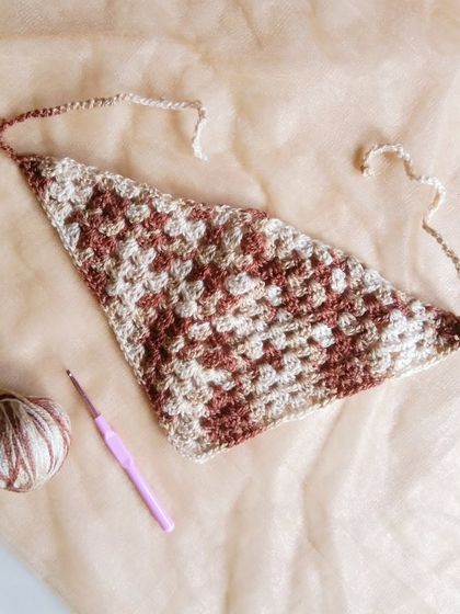 My crochet bandana headband is a stylish accessory for a bohemian or cottagecore look. It's lightweight and can be made in any color combination.