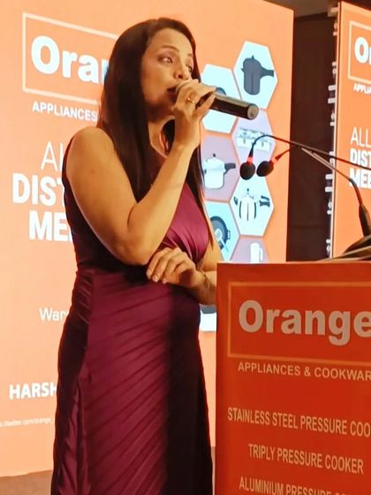 Addressing the attendees at the Orange Cookware distributor meet. It's crucial to communicate the company's profile, product knowledge, and new schemes in a way that is clear, engaging, and interactive.