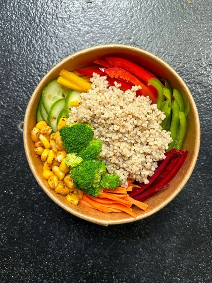 This is our Millet Surprise Salad Bowl. It's a simple yet satisfying combination of nutritious millets and a rainbow of fresh, crunchy vegetables like corn, broccoli, and bell peppers.