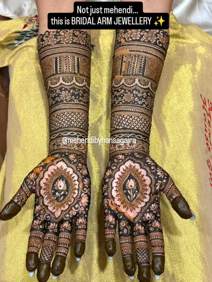 I believe bridal mehendi should feel like jewelry. This design features perfectly symmetrical patterns on both hands, with a central lotus motif and intricate bands that adorn the arms like timeless bracelets.