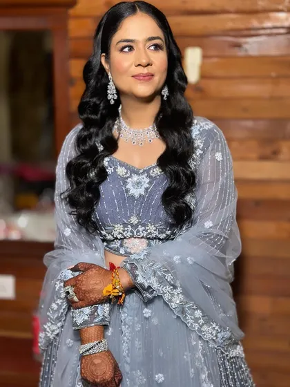 Bride Khushi looking lovely for her sangeet in a beautiful grey-blue lehenga. I gave her a soft, romantic look with pink tones on the eyes.