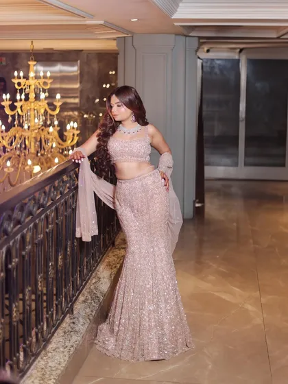 A final look at the stunning mermaid gown, showcasing its silhouette against the architectural details of the venue.