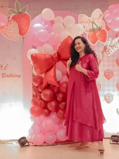 A solo shot of me at Gauri's birthday, giving a thumbs-up to the amazing decor. This allows me to individually praise the event management company, showing how I can create dedicated content for brand partners.
