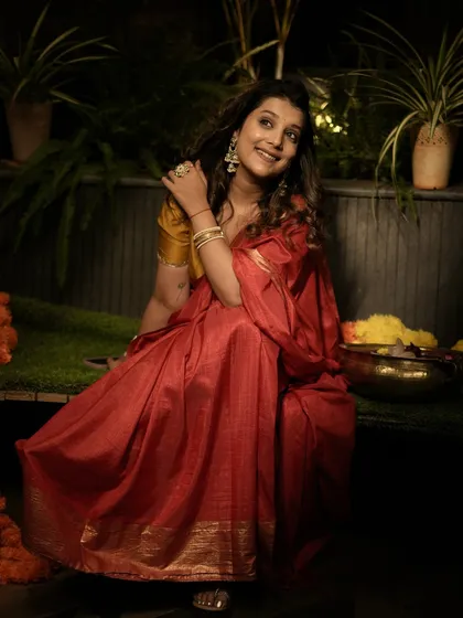 My own Diwali look, featuring a classic red and gold saree, styled for a traditional and festive feel.