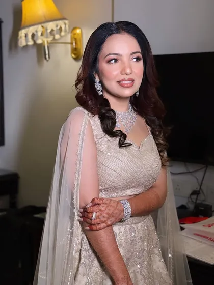 A happy and confident client, ready for her engagement party. The makeup is designed to be long-lasting and photo-ready.