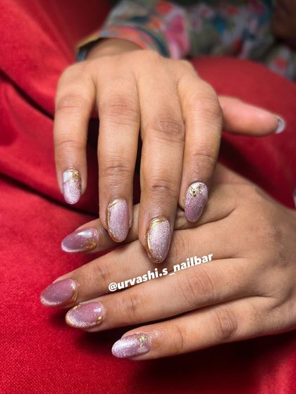 This collection showcases various cat-eye designs, from pink and gold glitter combinations to subtle shimmers with gold chrome tips. It highlights the versatility and enchanting effect of magnetic polishes.