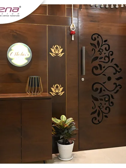 A classic and elegant entrance design. The dark wood finish on the door and surrounding panels is complemented by a custom backlit nameplate and delicate lotus motifs, creating a warm and traditional welcome.