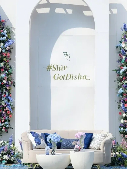 For a daytime event, I wanted to create a photo backdrop that was both fresh and breathtaking. This wall of flowers, with vertical columns of blue, purple, and white blooms, became a living piece of art for guests to enjoy.