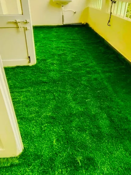 Even utility balconies can be upgraded. This installation shows our thick artificial turf covering the entire floor, making the space cleaner and more pleasant to use.