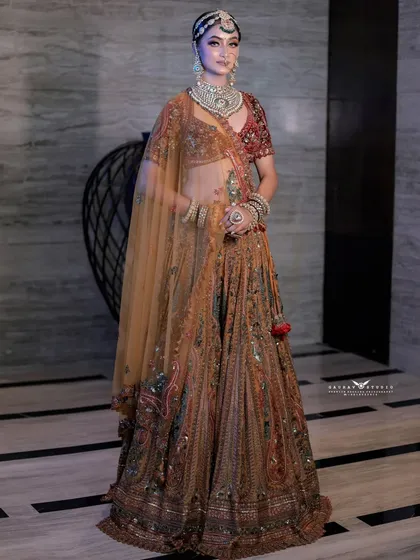 A full-length shot from a slightly different angle, highlighting the intricate patterns of the lehenga.