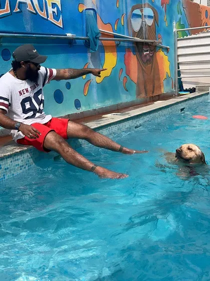 I love it when pet parents join in on the fun. Here's a quiet moment between a swim session.