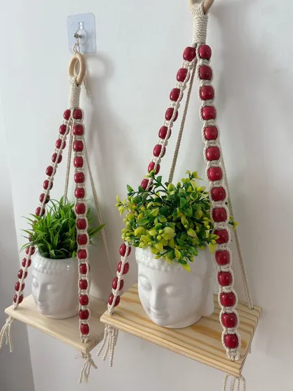 An angled view of the pair of planter shelves, showing how they can be hung at different heights to create a dynamic display.
