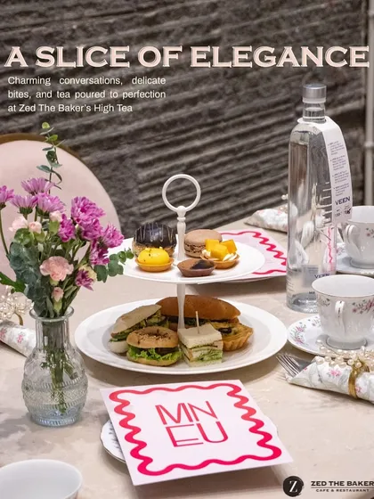 I believe High Tea should be an elegant and personal experience. Here is a setup from one of our events, featuring a tiered stand of delicate sandwiches, macarons, and pastries, all ready for an afternoon of charming conversation.