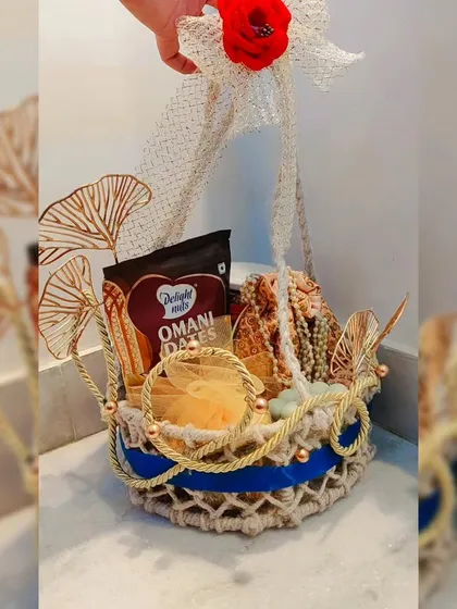 My bespoke luxury gift basket, featuring Omani dates, decorative pieces, and elegant golden accents in a handcrafted jute basket.