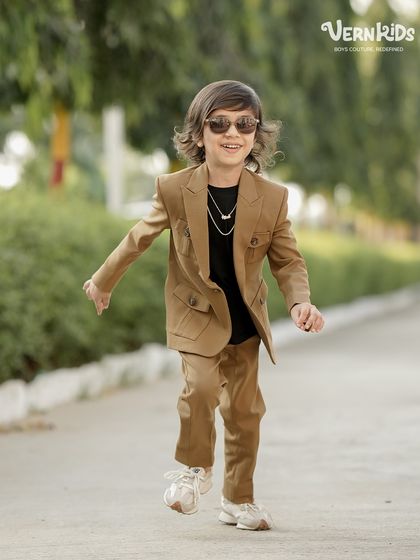 Another shot of this handsome star, showing off his custom-made shacket set. We believe every boy deserves an outfit that is exclusively his.