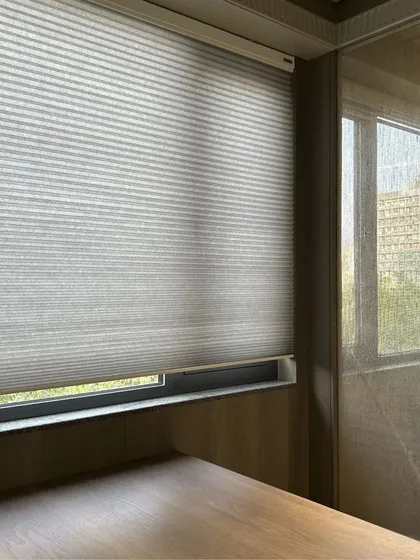 This newly finished office space is bathed in natural light. The use of translucent blinds allows for privacy while still keeping the environment bright and inspiring.