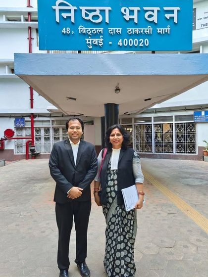 Outside Nishta Bhavan with my colleague. Our name means 'dedication,' and that is the principle with which we fight for justice every day.