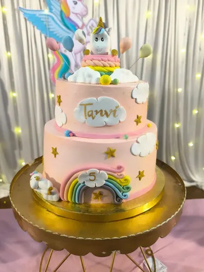 Another view of the two-tier unicorn cake, complete with a fondant unicorn, rainbow, and clouds. Seeing my niece's joyful reaction made all the long hours of baking and decorating worth it.