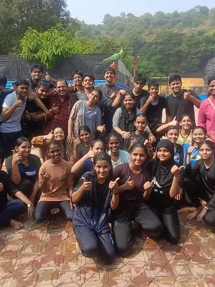The whole squad together. A large group photo of our students at the waterpark, capturing the scale of our fun-filled annual picnic.