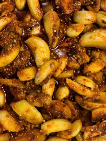 For all the garlic lovers, this is our Lehsun ka Achaar. The garlic cloves are pickled in a blend of spices that not only tastes amazing but is also known to be good for your heart.