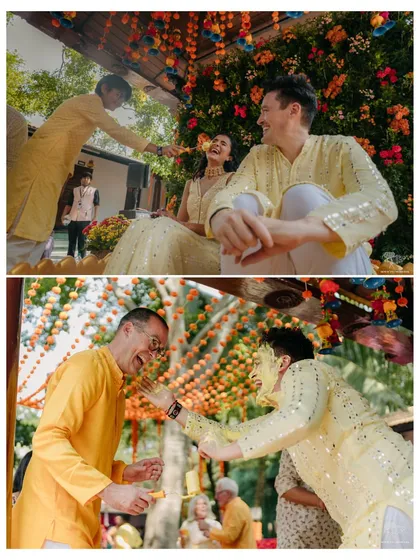 A playful moment during the Haldi ceremony. The couple and their guests share a laugh, capturing the fun and relaxed spirit of the day.