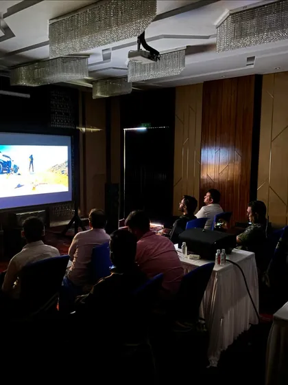 The training environment is set up to replicate a real-world home cinema scenario. Here, participants watch a film clip to critically listen and evaluate the results of their calibration work in a practical application.
