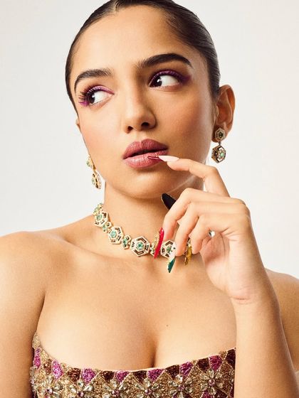 This shot shows how expressive hands can be with the right nail art. The custom design adds to the story of the overall look, making it more dynamic and interesting.