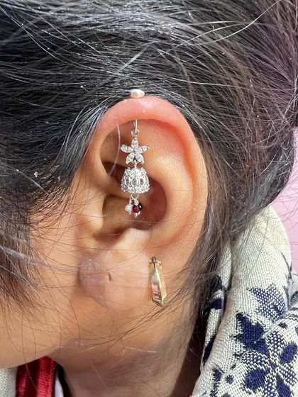 A traditional jhumka-style hanging with a ruby accent, perfect for a festive look.