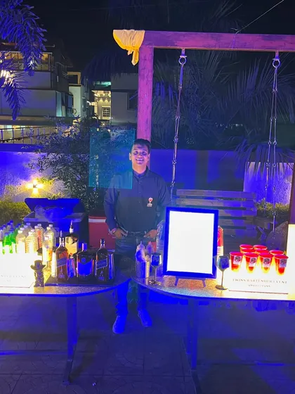 My setup for Mit and Nikita's outdoor evening event. Even a simple setup can be made elegant and inviting with the right lighting and presentation.