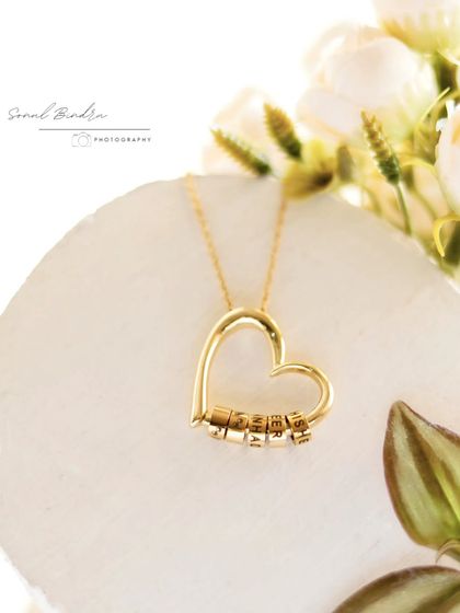 This shot captures a personal moment. I created this still life with a heart-shaped pendant, a soft floral backdrop, and warm, diffused light to tell a quiet story of love and connection.