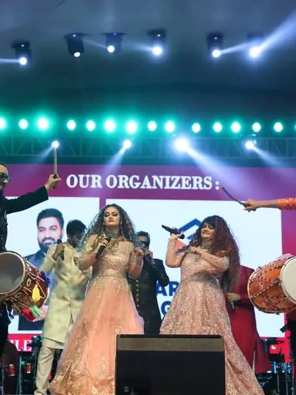 The full show experience. With our amazing band, dhol players, and stage effects like smoke cannons, we create a complete audio-visual spectacle. This was the grand finale of a nine-day Navratri event, and the energy was electric.