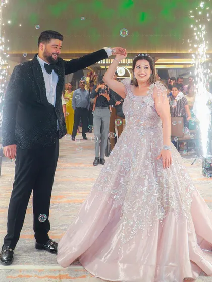 A magical moment on the dance floor. The bride's makeup is designed to be long-lasting and photo-ready, even with sparklers and bubbles.