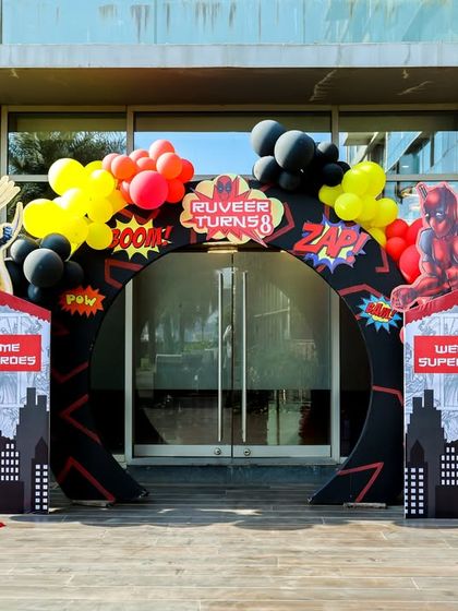 The full superhero entrance arch, featuring Deadpool and Wolverine, ready to welcome guests to the party.