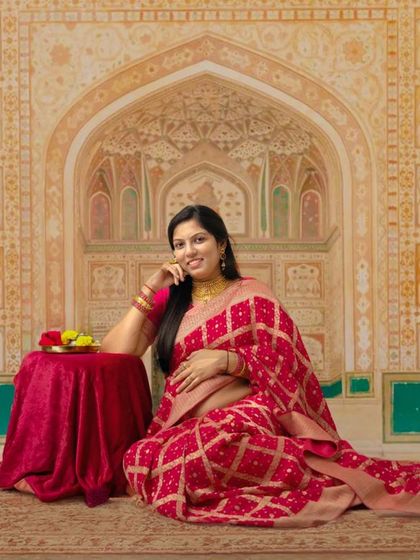 A royal maternity portrait inspired by the architecture of Jaipur. The intricate backdrop and the elegant pose create a photo that is both grand and personal.
