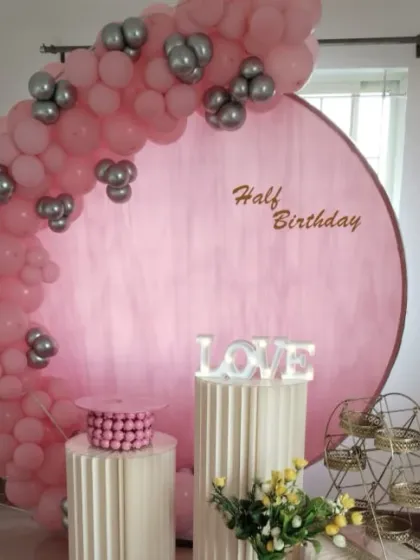 A full view of the pink and silver half-birthday setup, a lovely way to celebrate a six-month milestone.