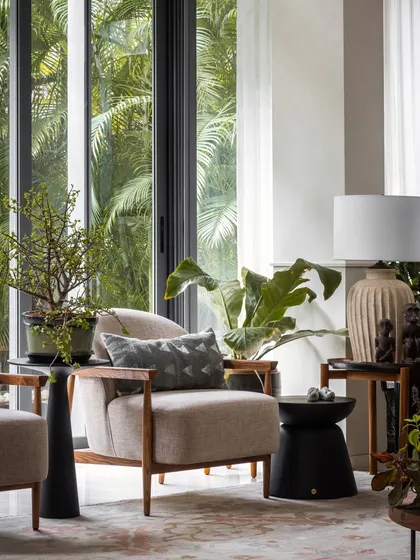 This quiet corner, with its comfortable armchair and view of the garden, was designed as a perfect spot for reading or quiet contemplation.