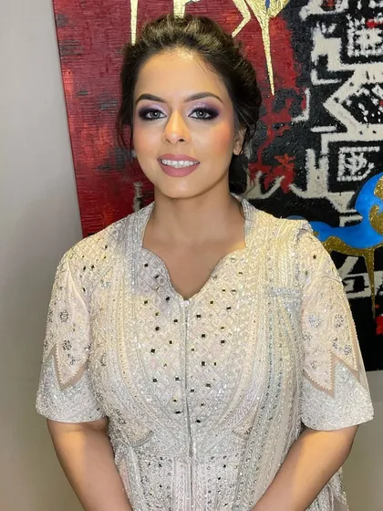 A beautifully blended look for this client in a stunning embellished gown. The purple and silver tones on her eyes add a touch of modern elegance.