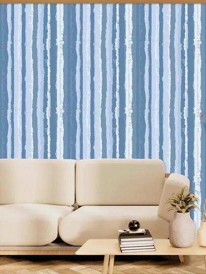 A similar painterly stripe pattern, this time in calming shades of blue. This design from the Polo collection is perfect for creating a serene and relaxed living space.