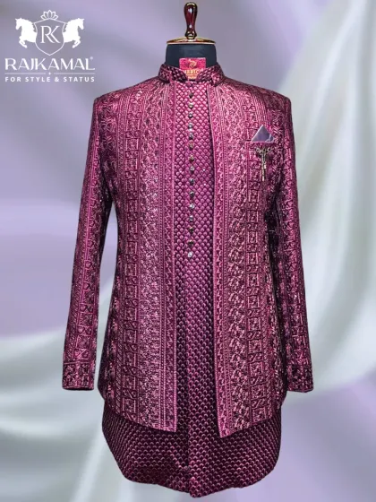 I love working with rich, bold colors. This layered Jodhpuri ensemble in a deep magenta features intricate, tone-on-tone embroidery, creating a look that is both majestic and perfect for a Sangeet or reception night.