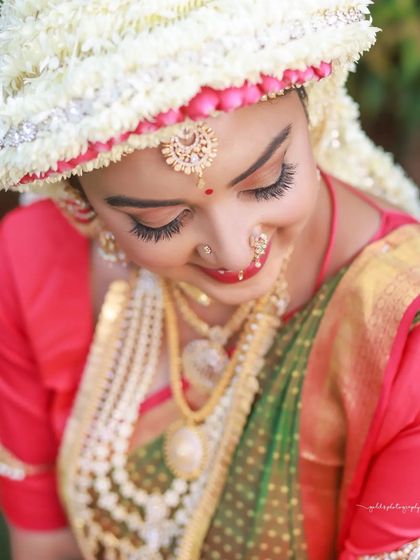 Another beautiful close-up of the Sharadha Jalli, focusing on the bride's joyful expression and flawless makeup.